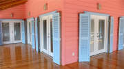Porch wraps around front of house