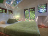Luxurious bed and skylight in the second floor bedroom